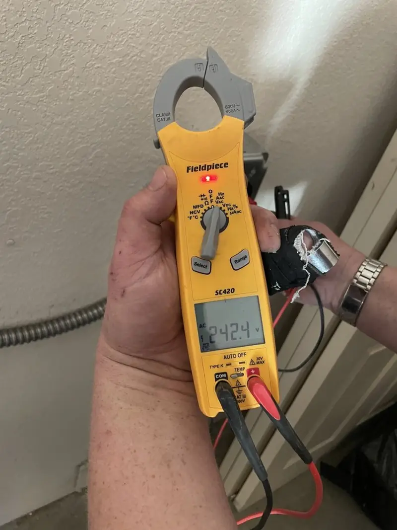 Voltage testing with clamp meter during Circuit Breaker Repair in Lake Norman of Iredell